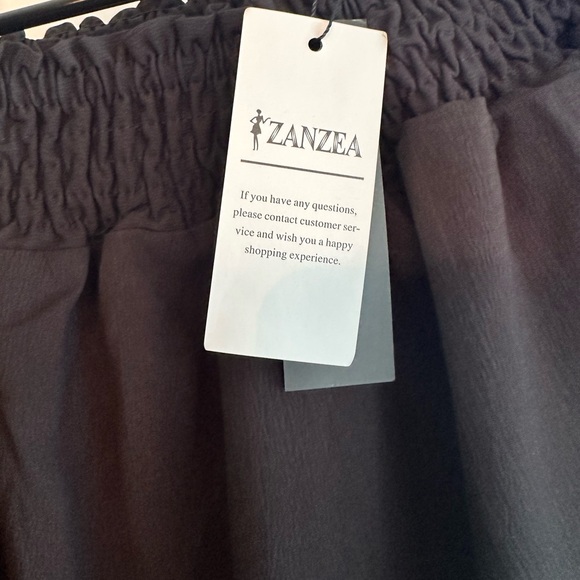 ⭐️NWT Black off the shoulder dress with ruffle sleeves and hem - Picture 8 of 8